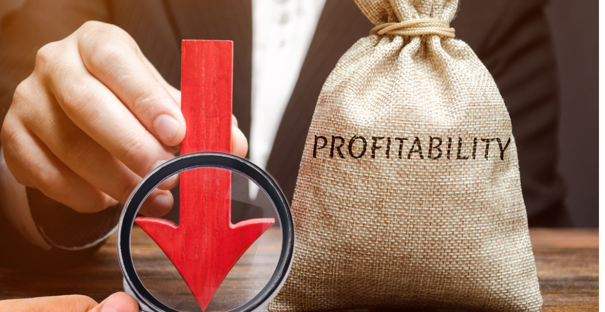 Hand holds down arrow on profitability