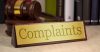 Complaint sign and gavel