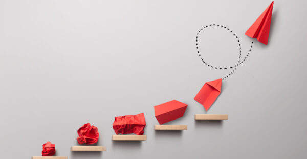 Red paper ball becomes paper plane