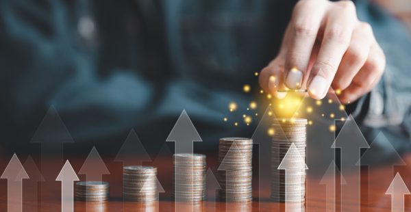 Hand tops growing coins