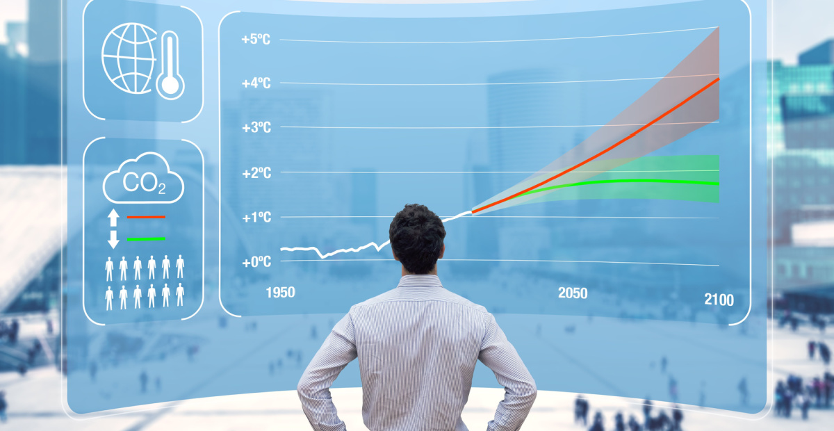 Man standing in front of climate graphics