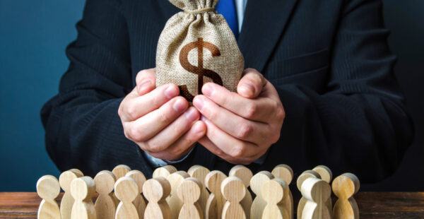 Hands holding compensation money sack