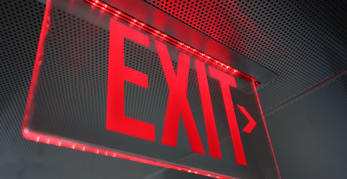 Illuminated red exit sign
