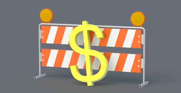 Dollar sign in front of barrier