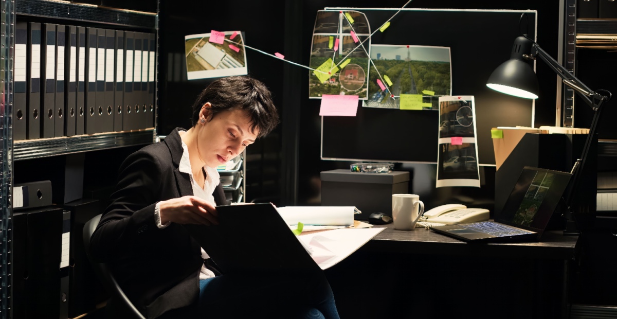 Woman at desk investigating