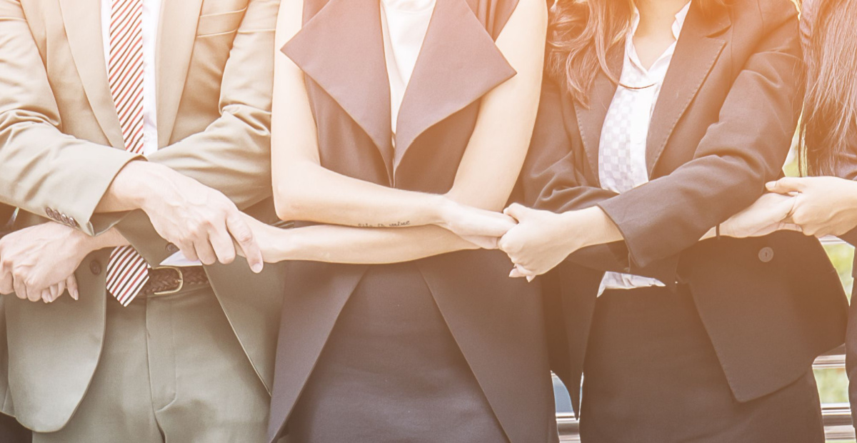 People holding interlinked hands