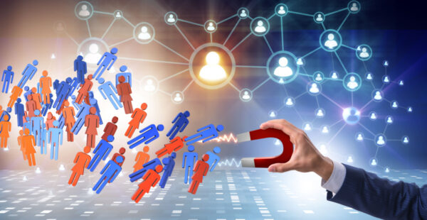 Hand with magnet attracting talent