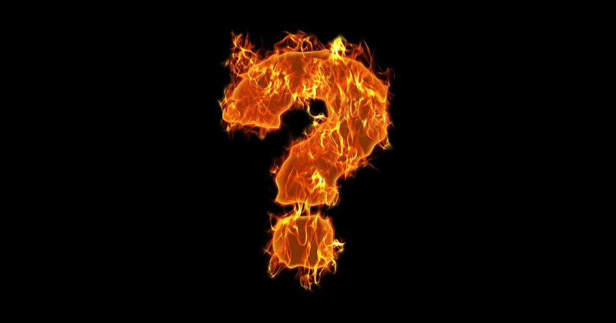 Flaming question mark on black background