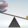 Small ball pushing down a see-saw with big ball on other side