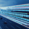 Image of city highway with zeros and ones extending across