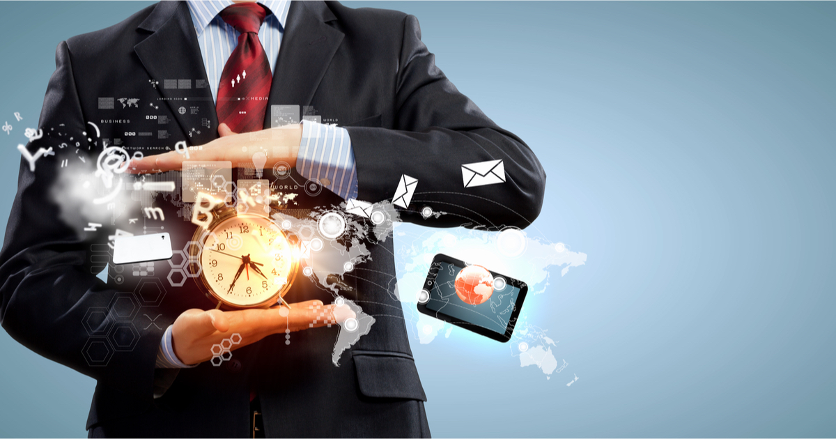 Business man holding a clock and iPad with graphics of email mixed