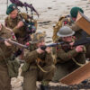 Soldiers with guns on beach