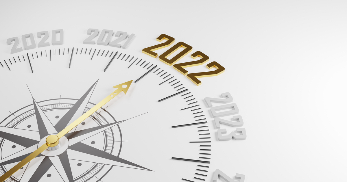 Gold compass pointing to 2022