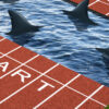 A running track split in the middle with sharks swimming