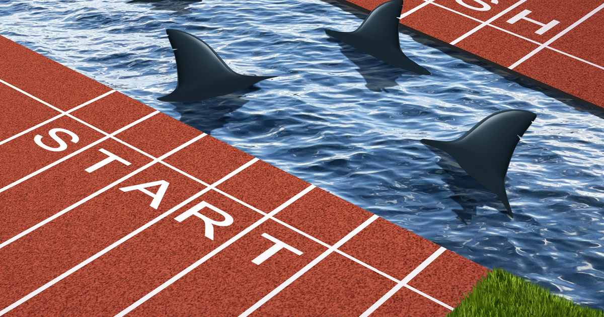 A running track split in the middle with sharks swimming