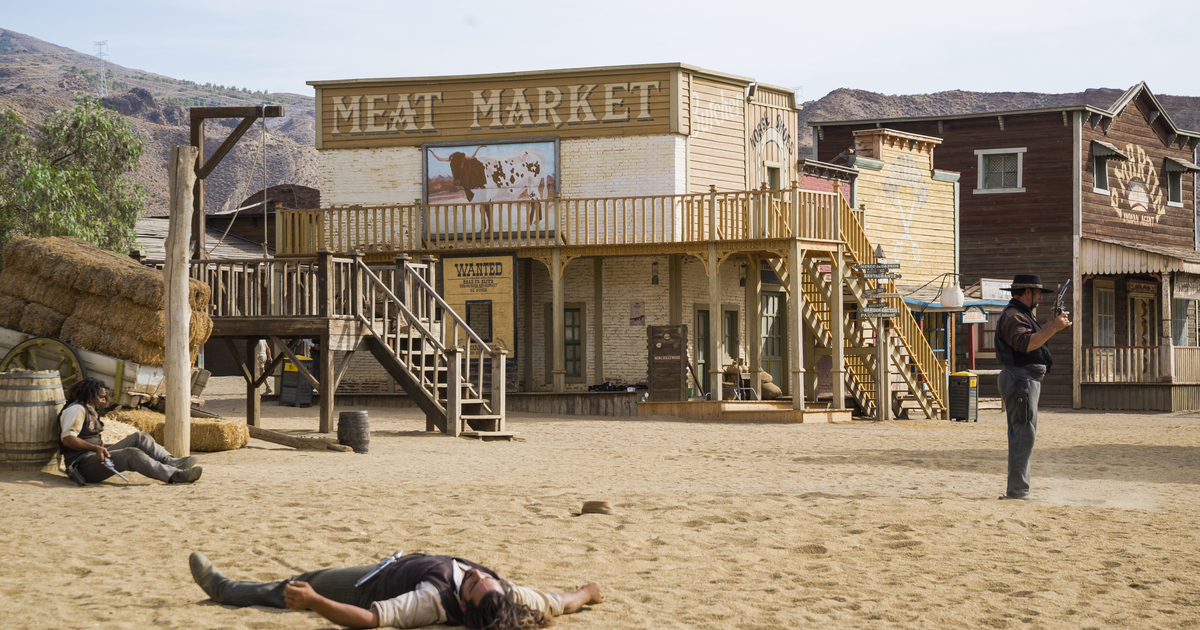 Cowboys with guns in a Wild West scene