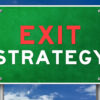 Green sign with Exit Strategy written in red and white