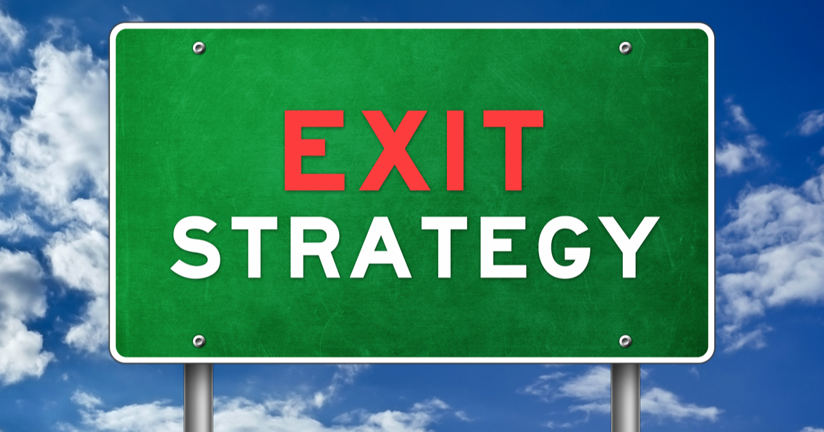 Green sign with Exit Strategy written in red and white