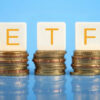 ETF letters sitting on 3 stacks of coins