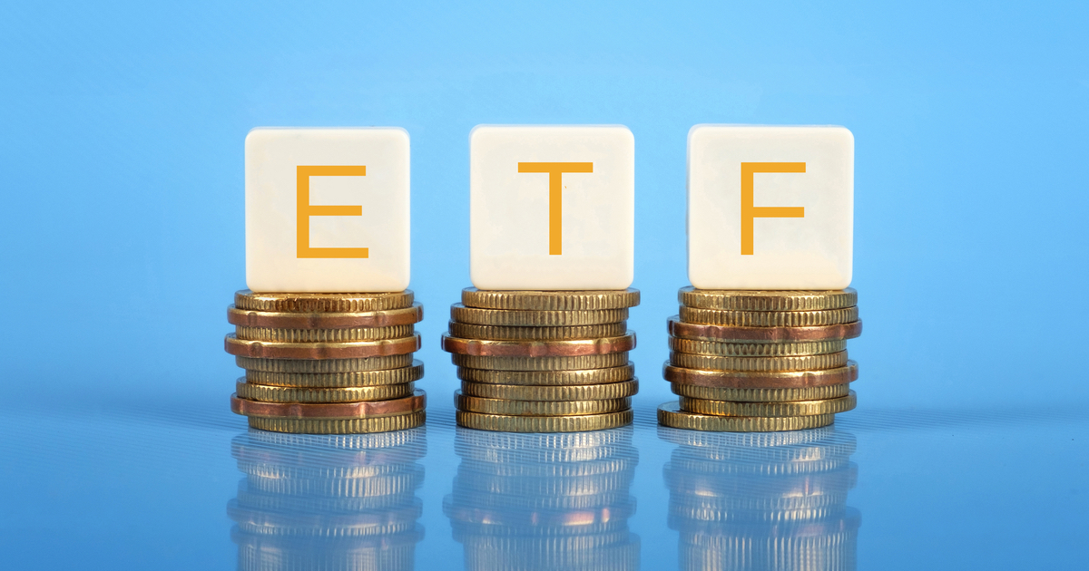 ETF letters sitting on 3 stacks of coins