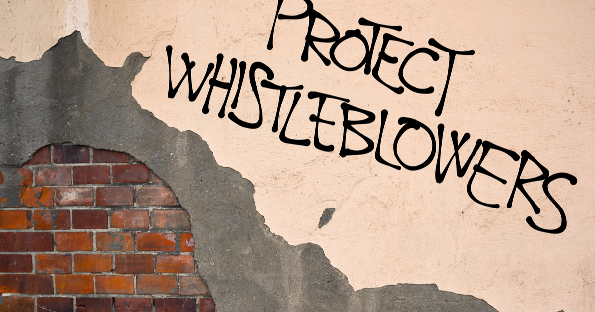 Wall with Protect Whistleblowers sprayed like graffiti
