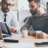 Financial adviser sitting with couple talking through options