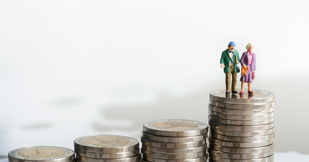 Figures of old man and woman on top of coins